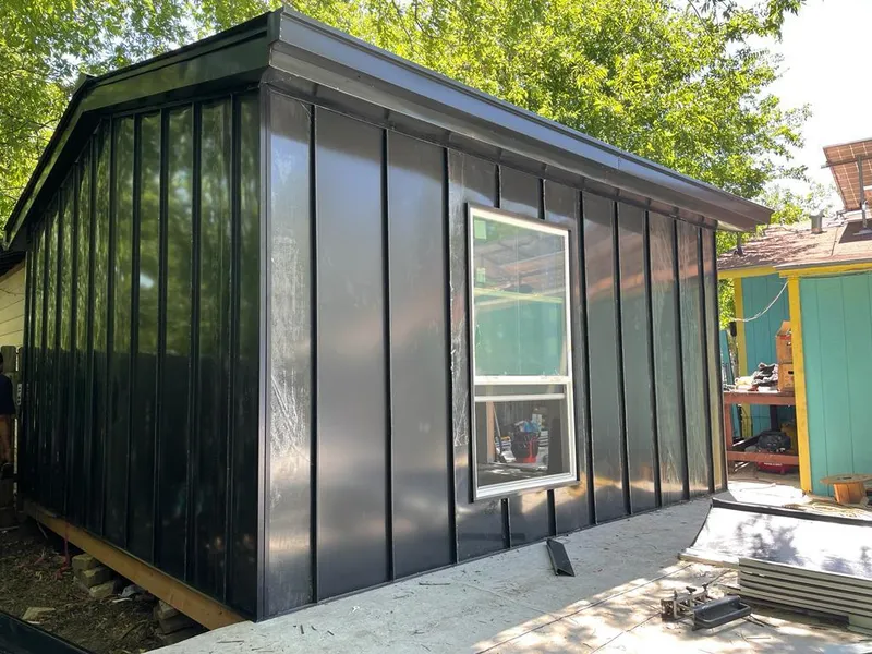 Black standing seam metal wall panels for Roof Inspection in Longview